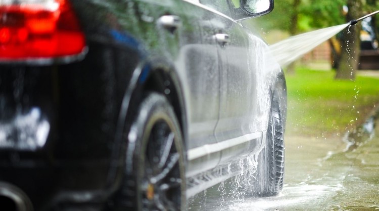 a car being washed in the backyard
