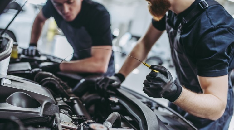 Car Oil Getting Changed at Facility