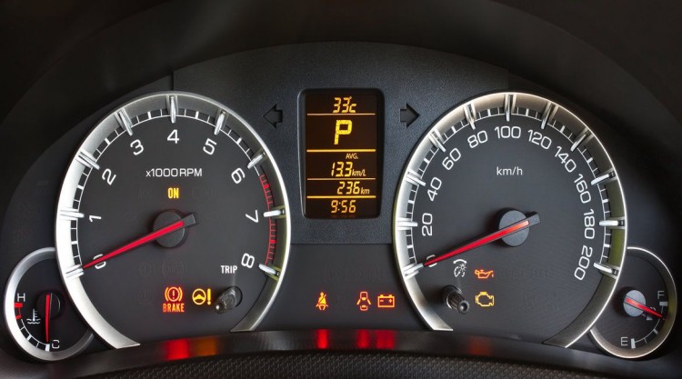 Car dashboard with reduced engine power light coming on
