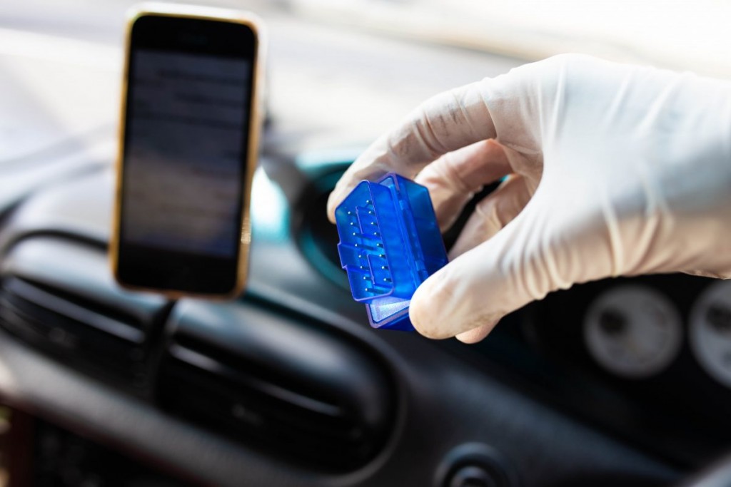 OBD2 bluetooth scanner for a car, connecting with a smartphone