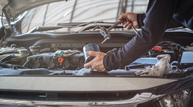 Changing Oil Filter With Wrench