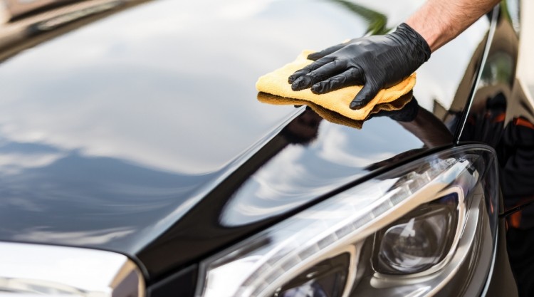 Waxing a Black Vehicle With Protective Car Wax