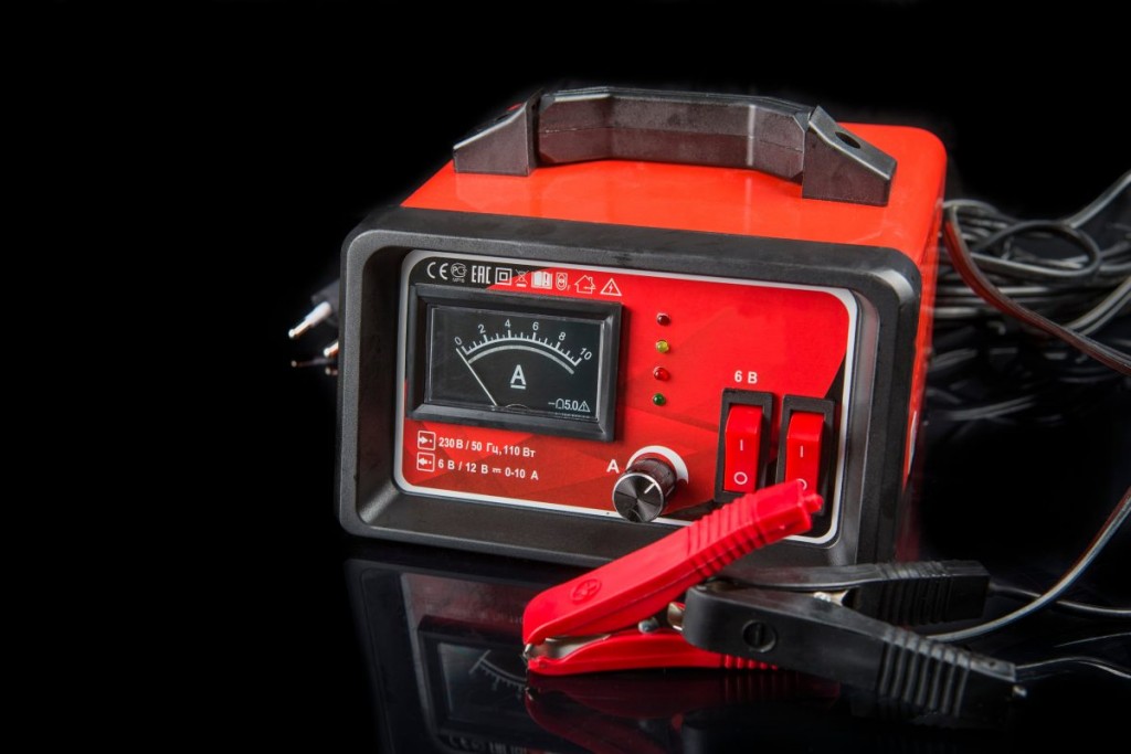 A universal car battery charger isolated on black