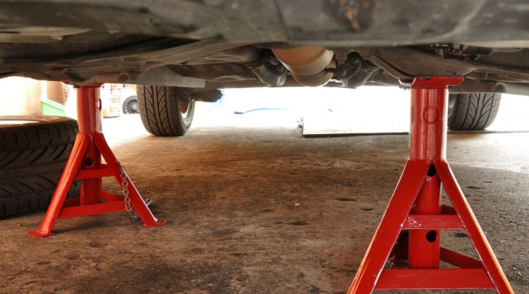 a pair of red jack stands in use