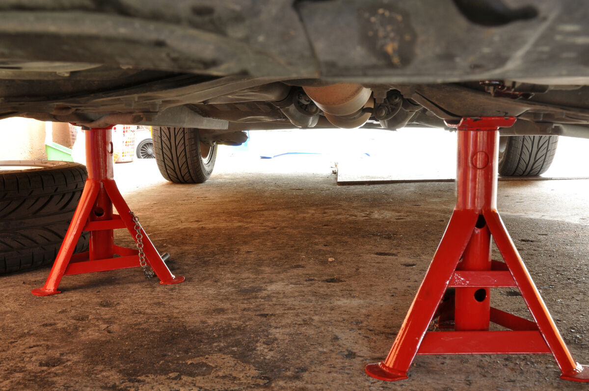 a pair of red jack stands in use