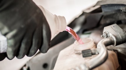 Puring Antifreeze into a Car