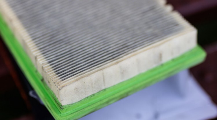 Close up on a dirty cabin air filter that needs to be replaced