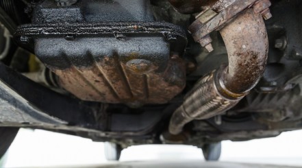 Looking at the underneath of a rusting car