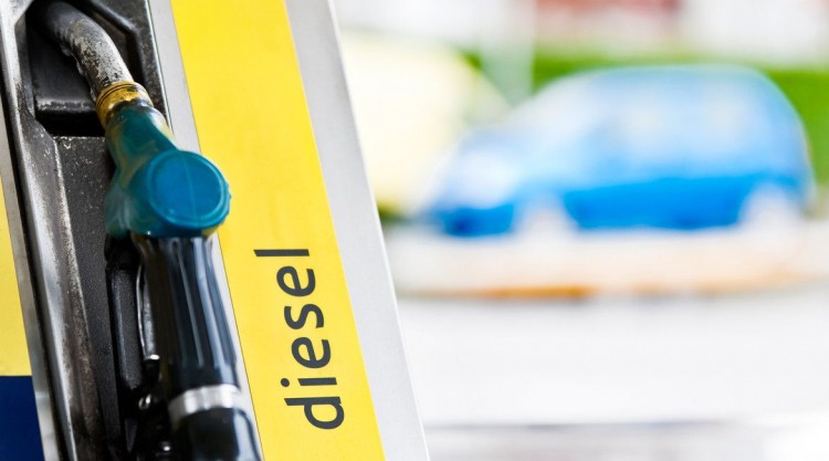 Close up picture of a diesel fuel handle at a gas station