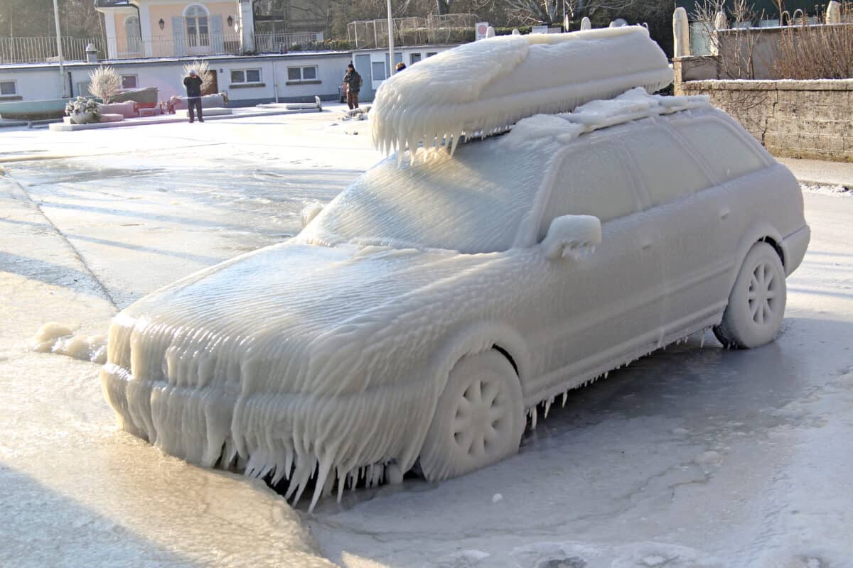 A frozen car, covered with ice and icicles