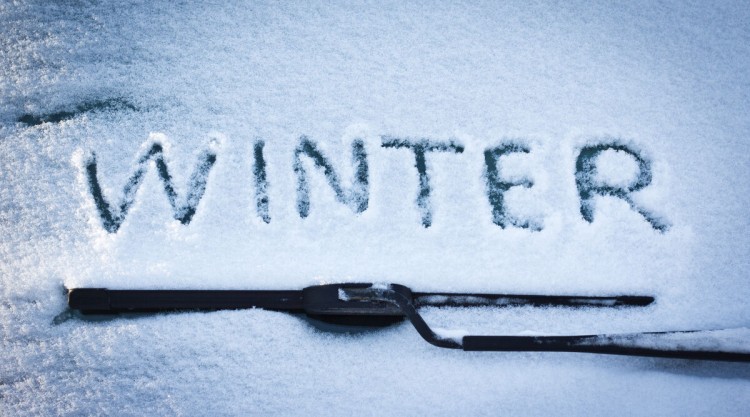 Close up of winter wiper blades, and the word