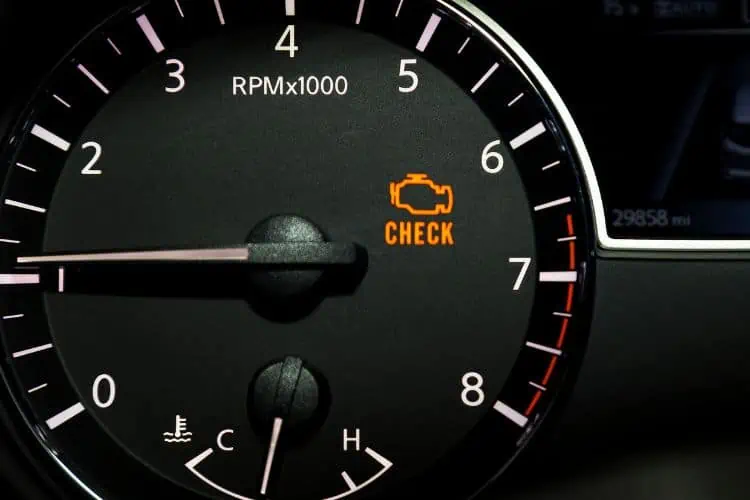Check engine warning light on car dashboard