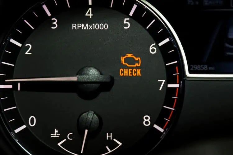 Check engine warning light on car dashboard 