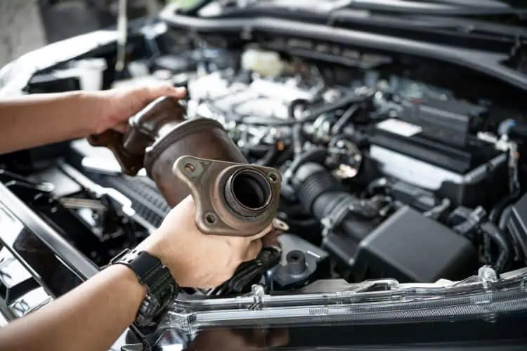 Close up of a catalytic converter removed from a car