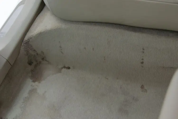 Coffee stains on cream floor of car