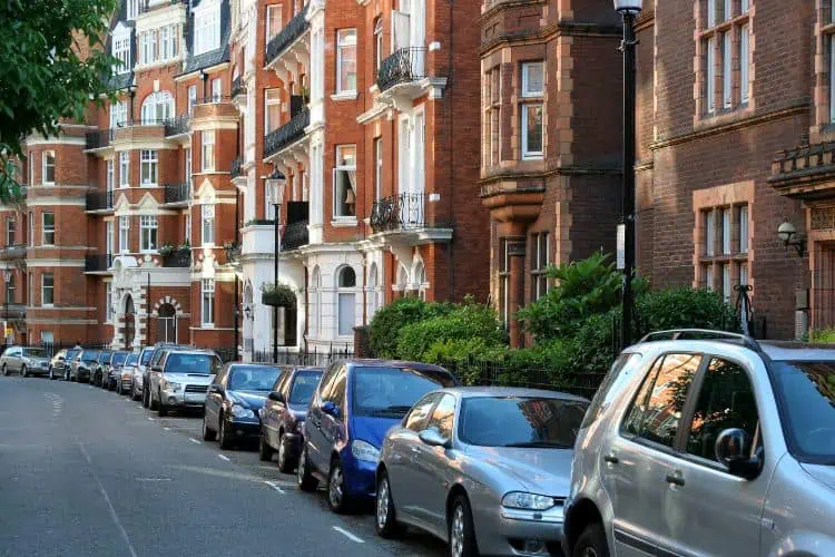 Line of cars parked in a residential street