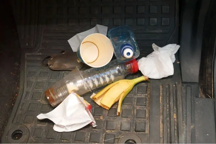 Variety of trash on car floor