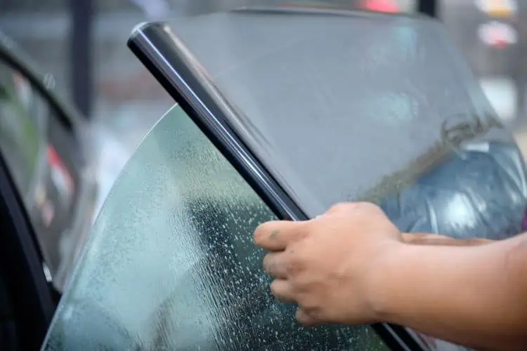 Ceramic tint being applied to car window