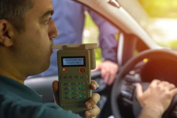 Driver pulled over by police for a breathalyzer test 