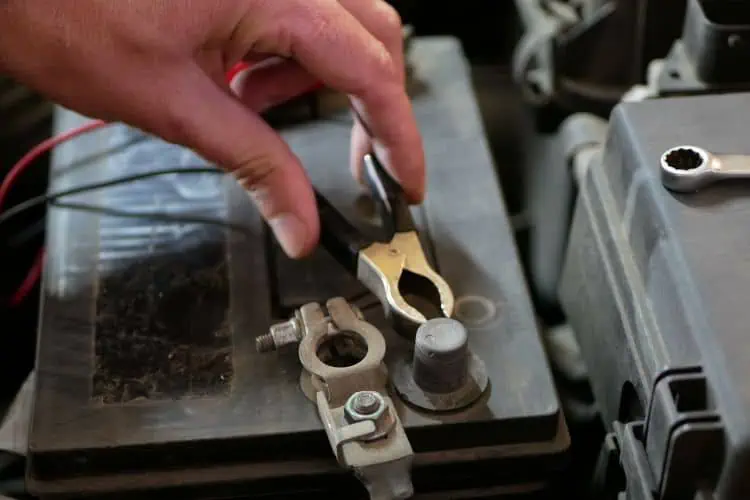 Hand disconnecting car battery terminals 