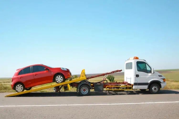 Car being towed by tow truck