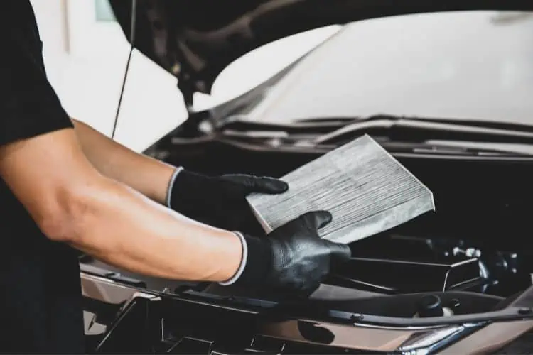 Man holding air filter