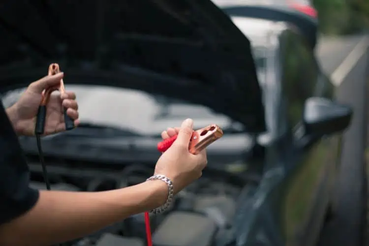 Man holding jumper cables