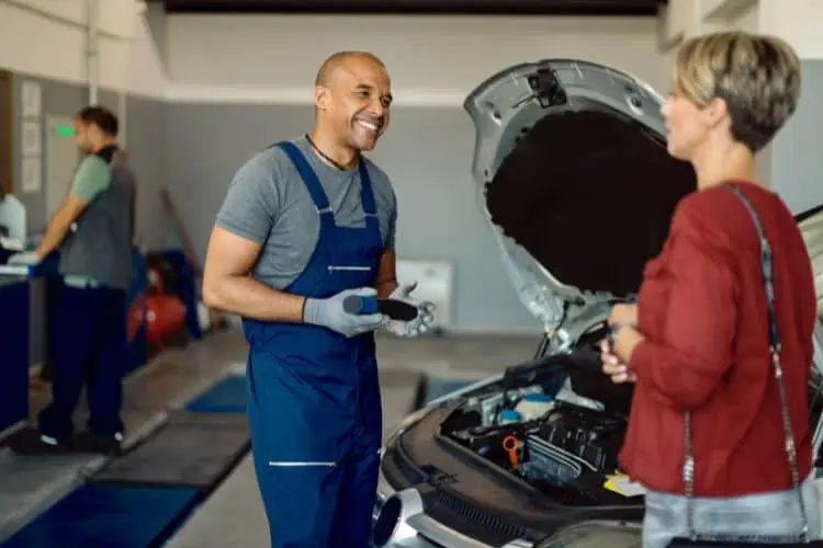 Mechanic talking to customer