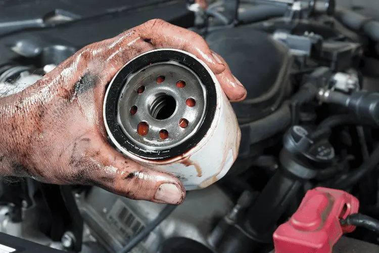 Man holding oil filter